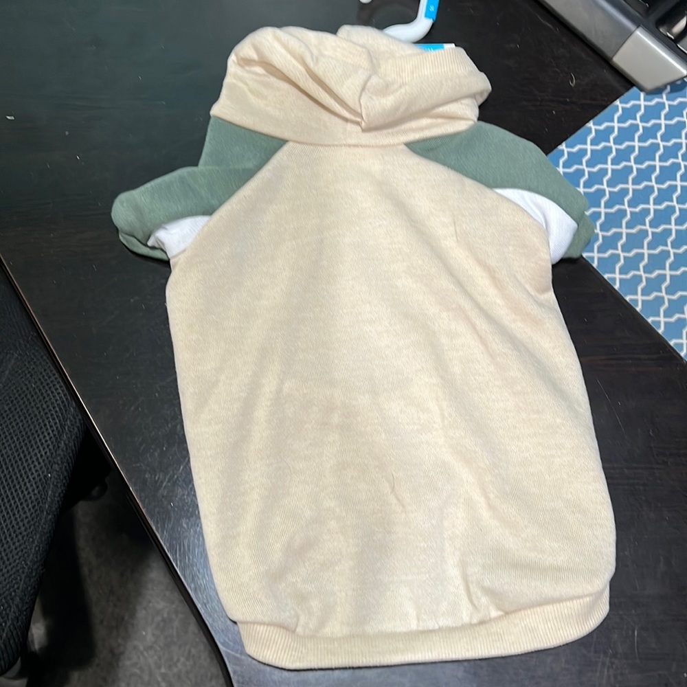 Cream dog hoodie with green sleeves